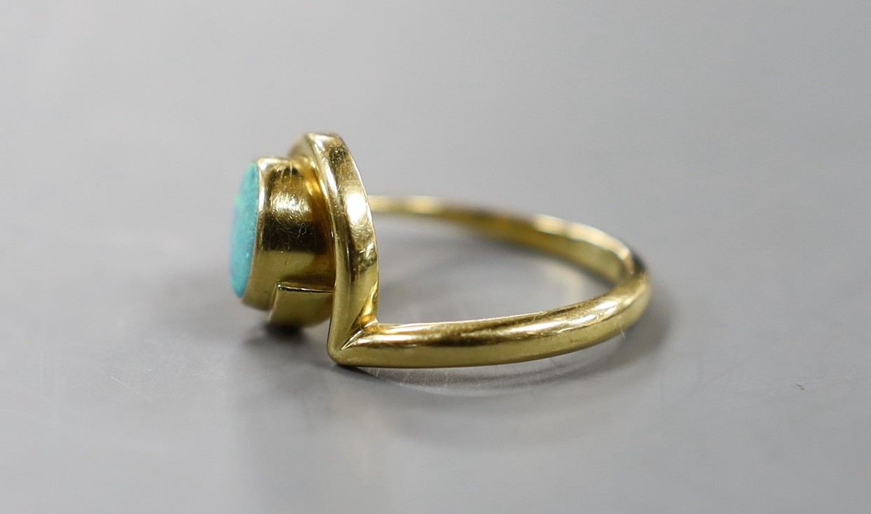 A modern 18ct gold and white opal set ring, size R, gross weight 6.2 grams.